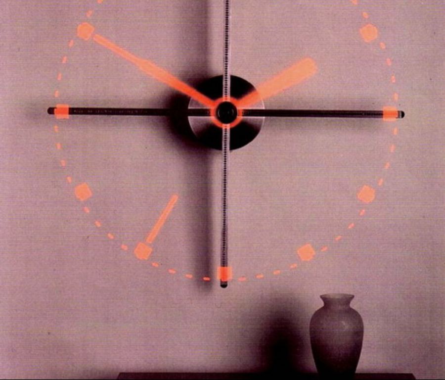 The Virtual Image Clock relies on the human eye’s persistence of vision to create the image of a clock face from its 4 rotating arms.