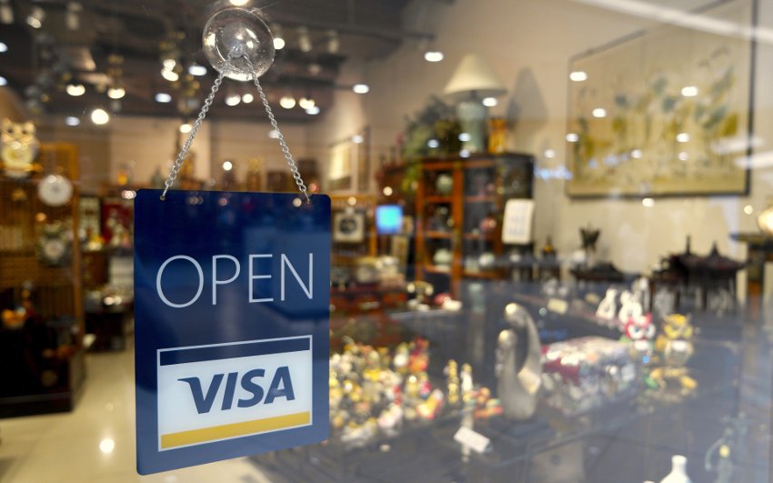 open for visa payments sign for a store 