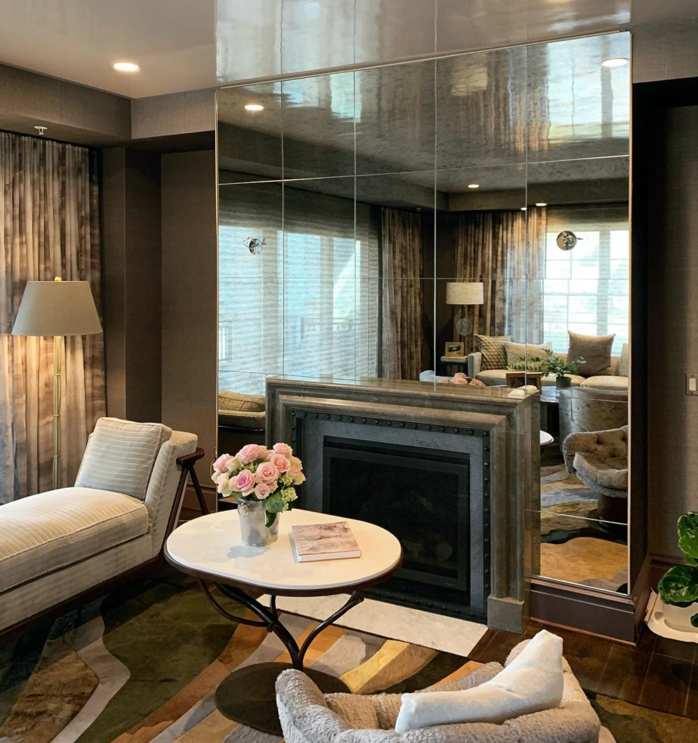Custom glass mirror installation in a living room