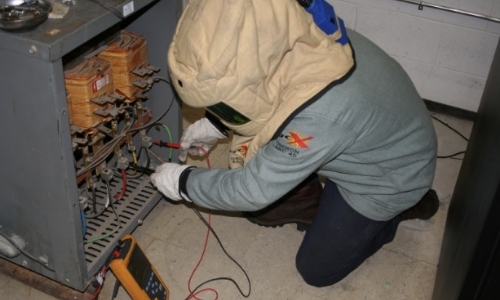 Figure 2 - BoPat Technician Conducting Power Quality Testing