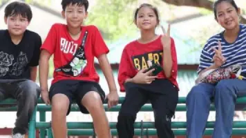 AITIS students sitting together outdoors