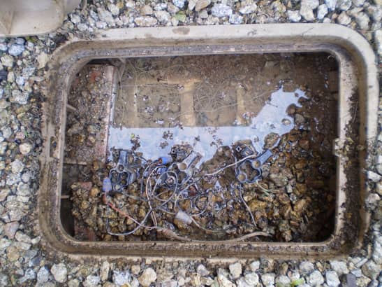 5-Valve-Box-Filled-With-Water-Debris
