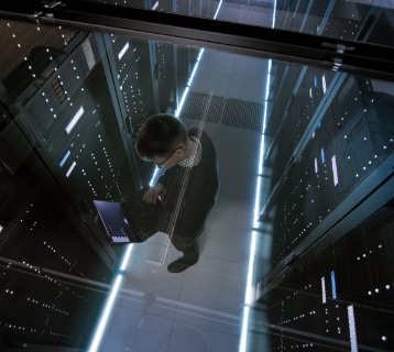 a person standing in a data center