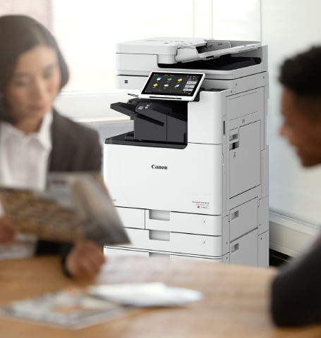 a person pressing printing machine bottom