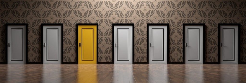 many doors - all white except a yellow door. This is to show that by going to banks and alternative lenders, business owners can chose the best option for them and not be limited by just what's offered at a bank.