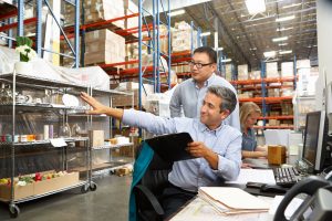 Small Business Warehouse Staff using Computers and IT